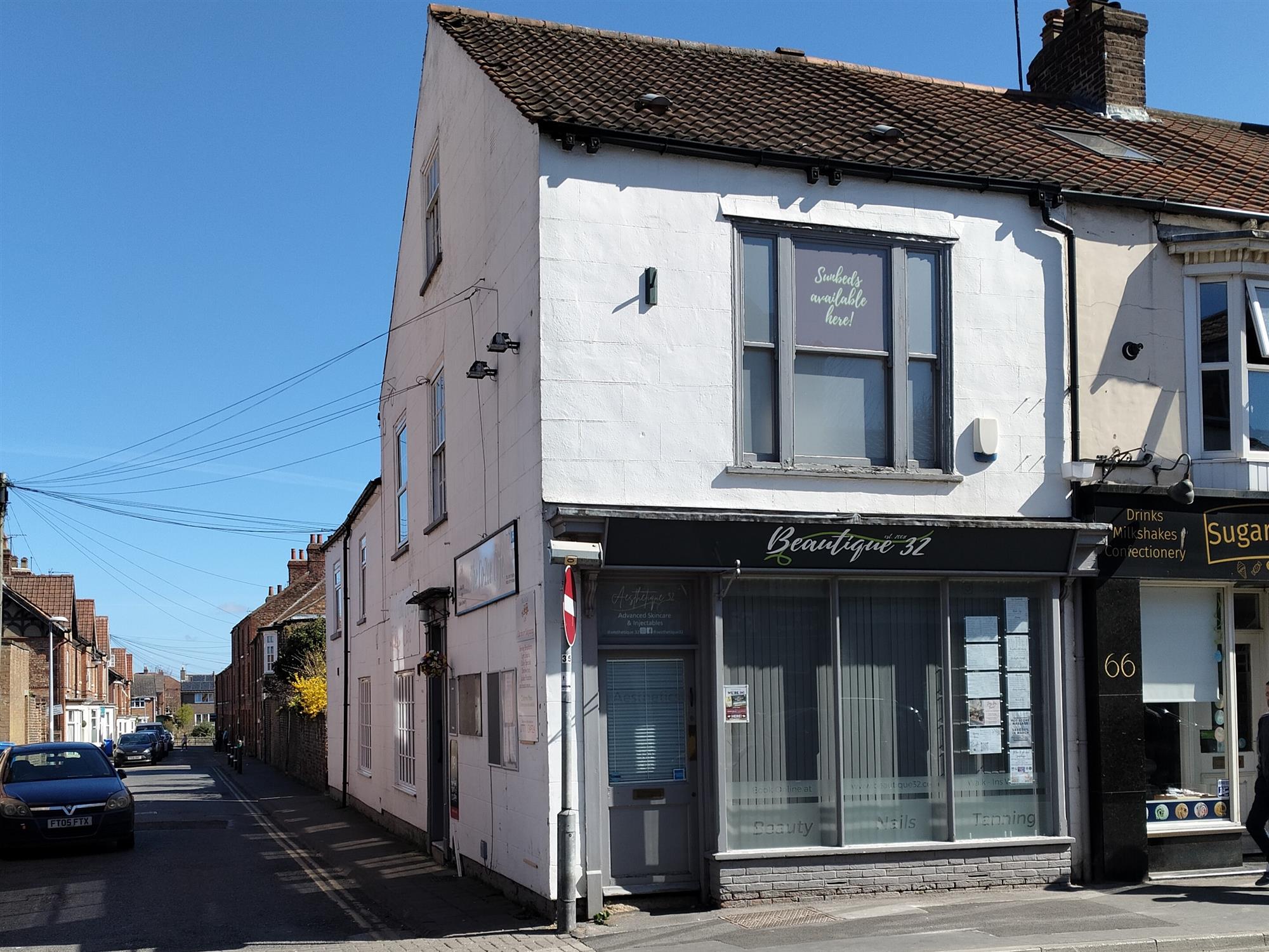 BEAUTY AND TANNING SALON WITH INVESTMENT PROPERTY